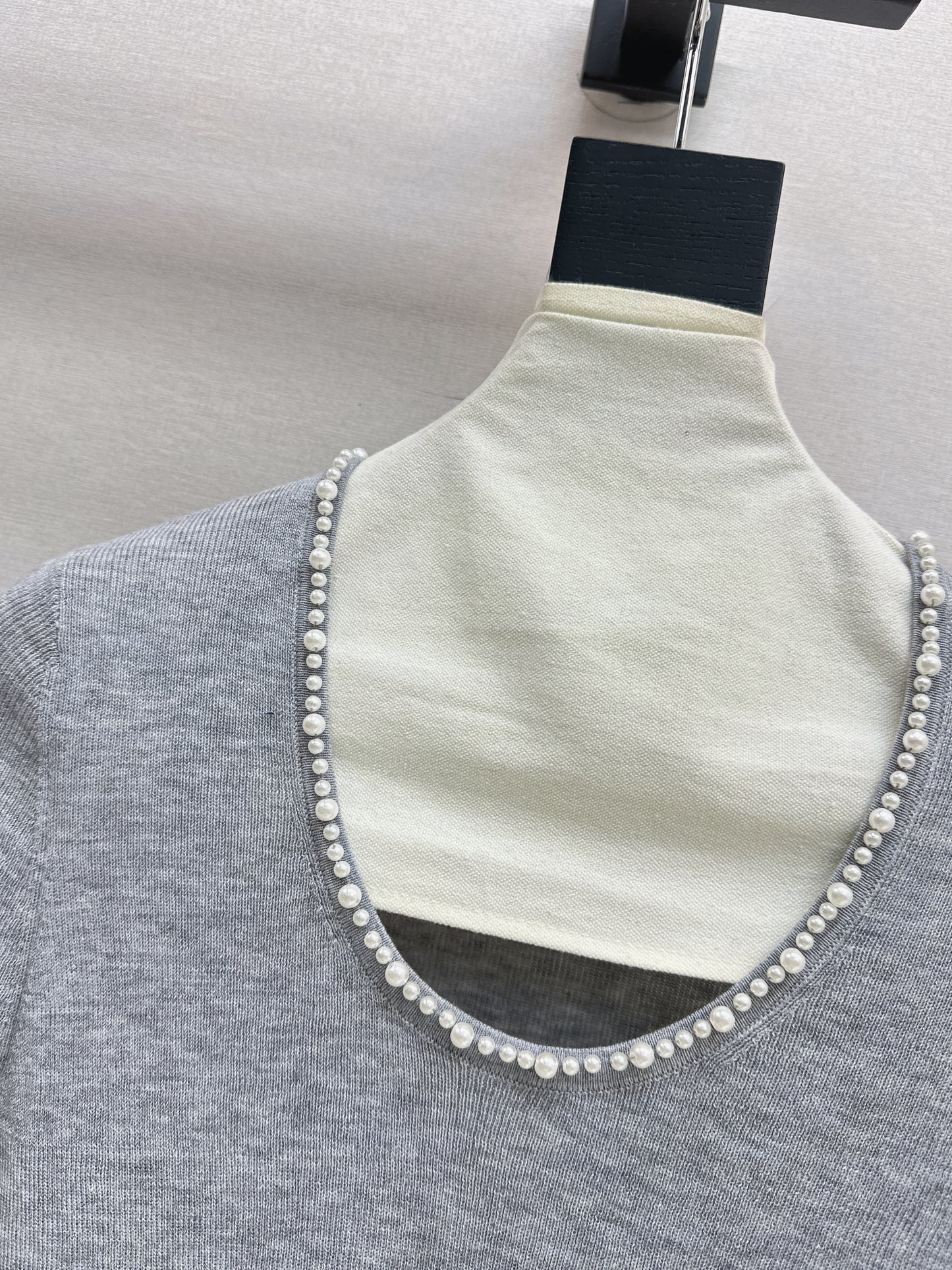 Pearl embellishments on a short-sleeved top