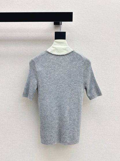 Pearl embellishments on a short-sleeved top