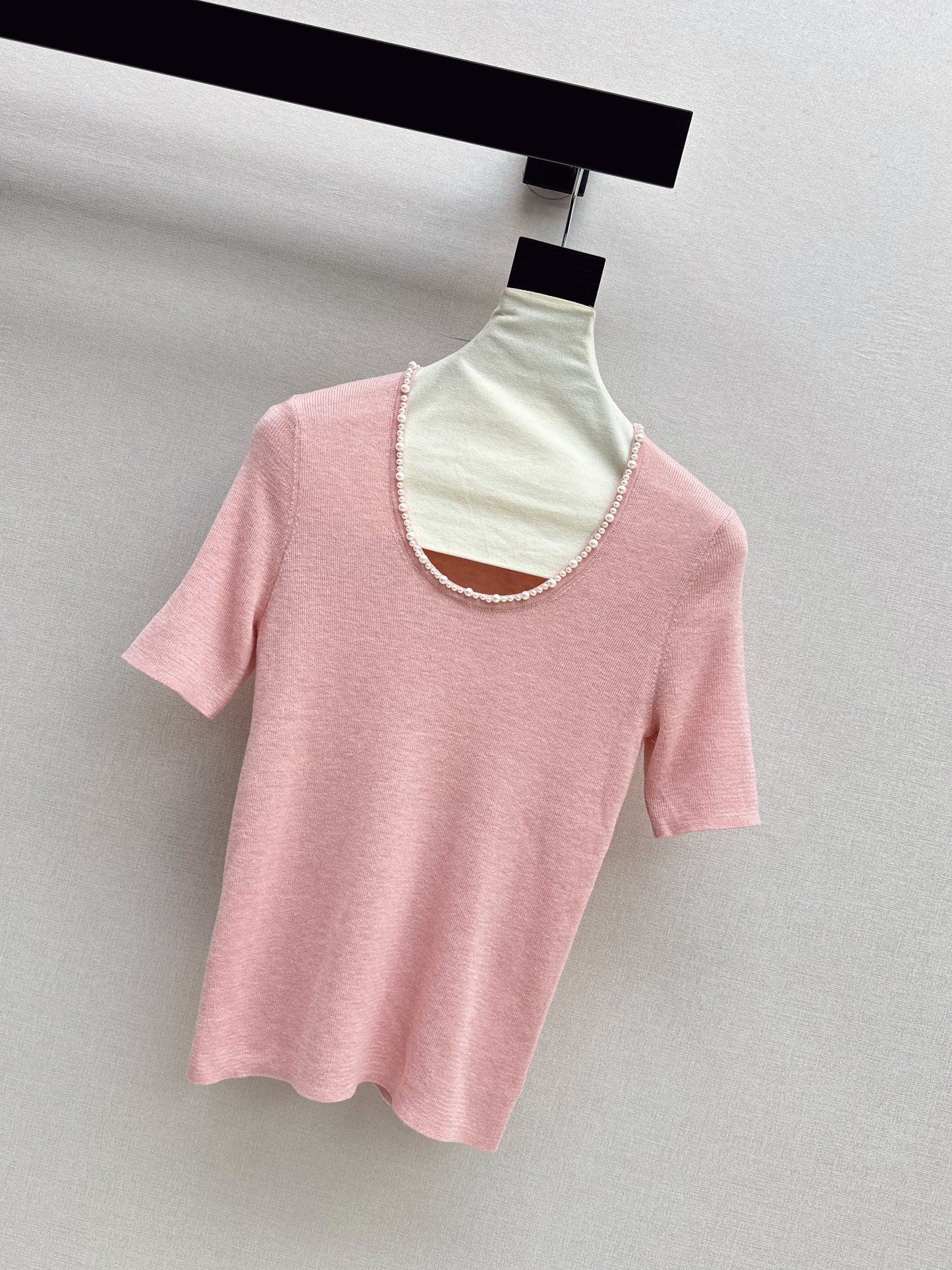 Pearl embellishments on a short-sleeved top