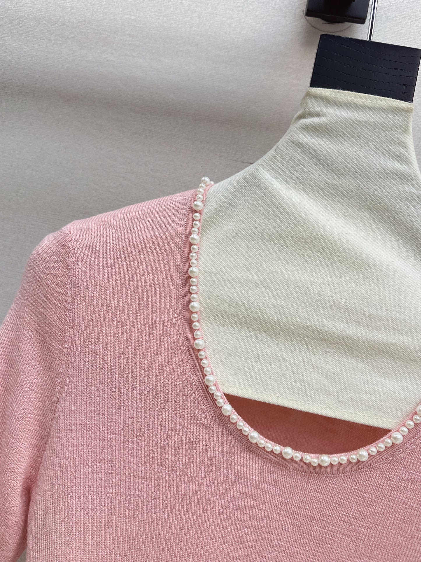 Pearl embellishments on a short-sleeved top