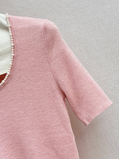 Pearl embellishments on a short-sleeved top