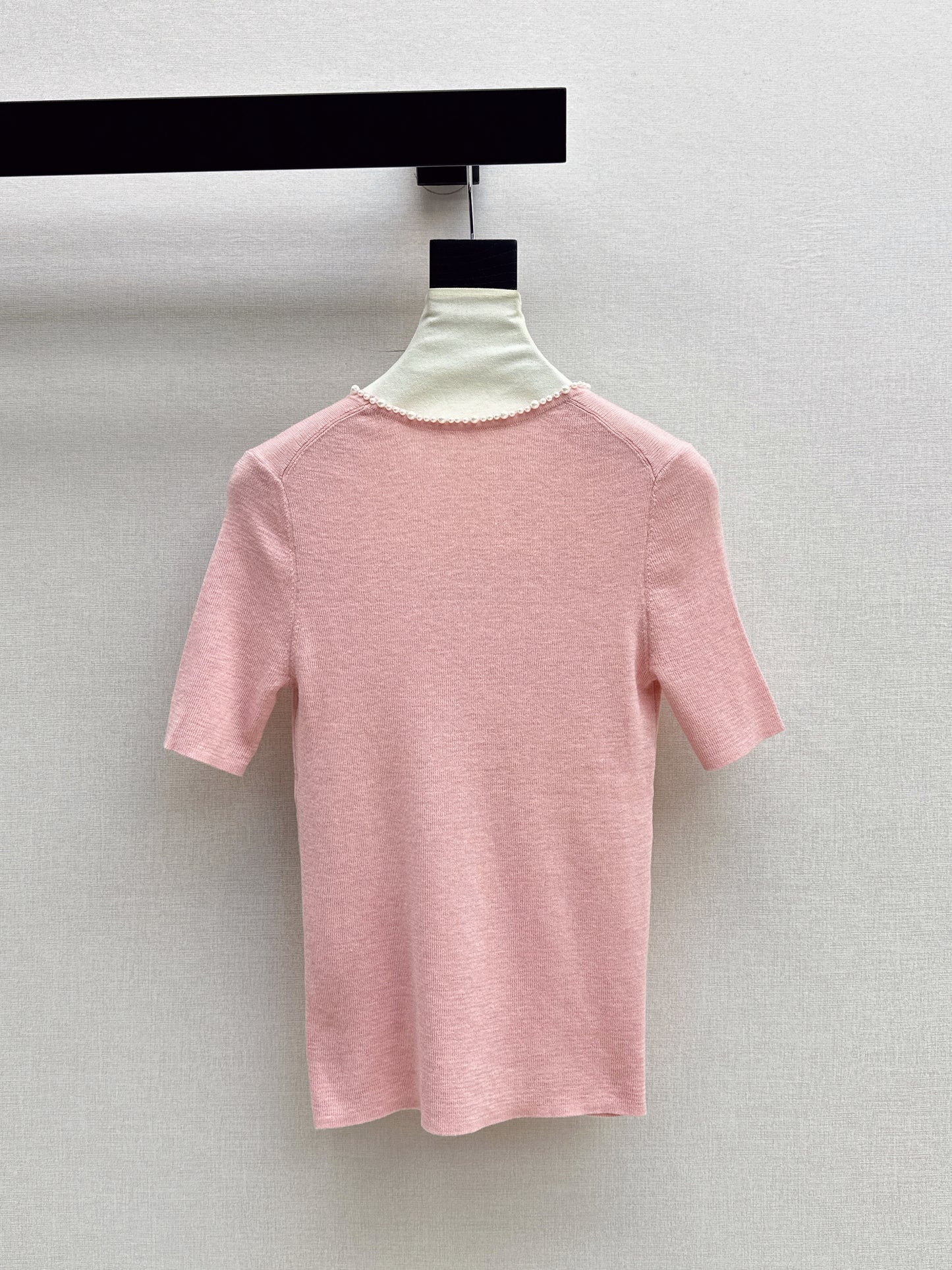 Pearl embellishments on a short-sleeved top