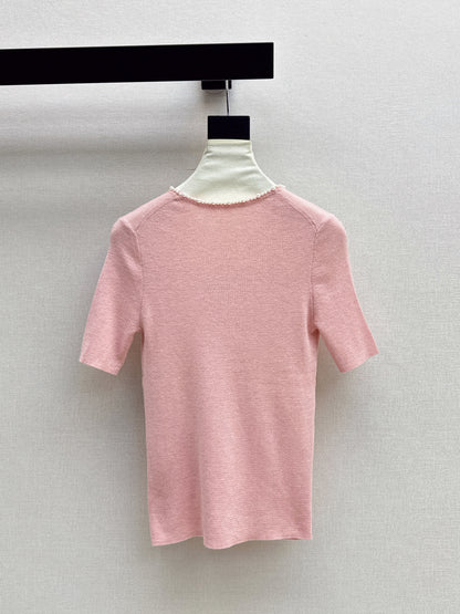 Pearl embellishments on a short-sleeved top