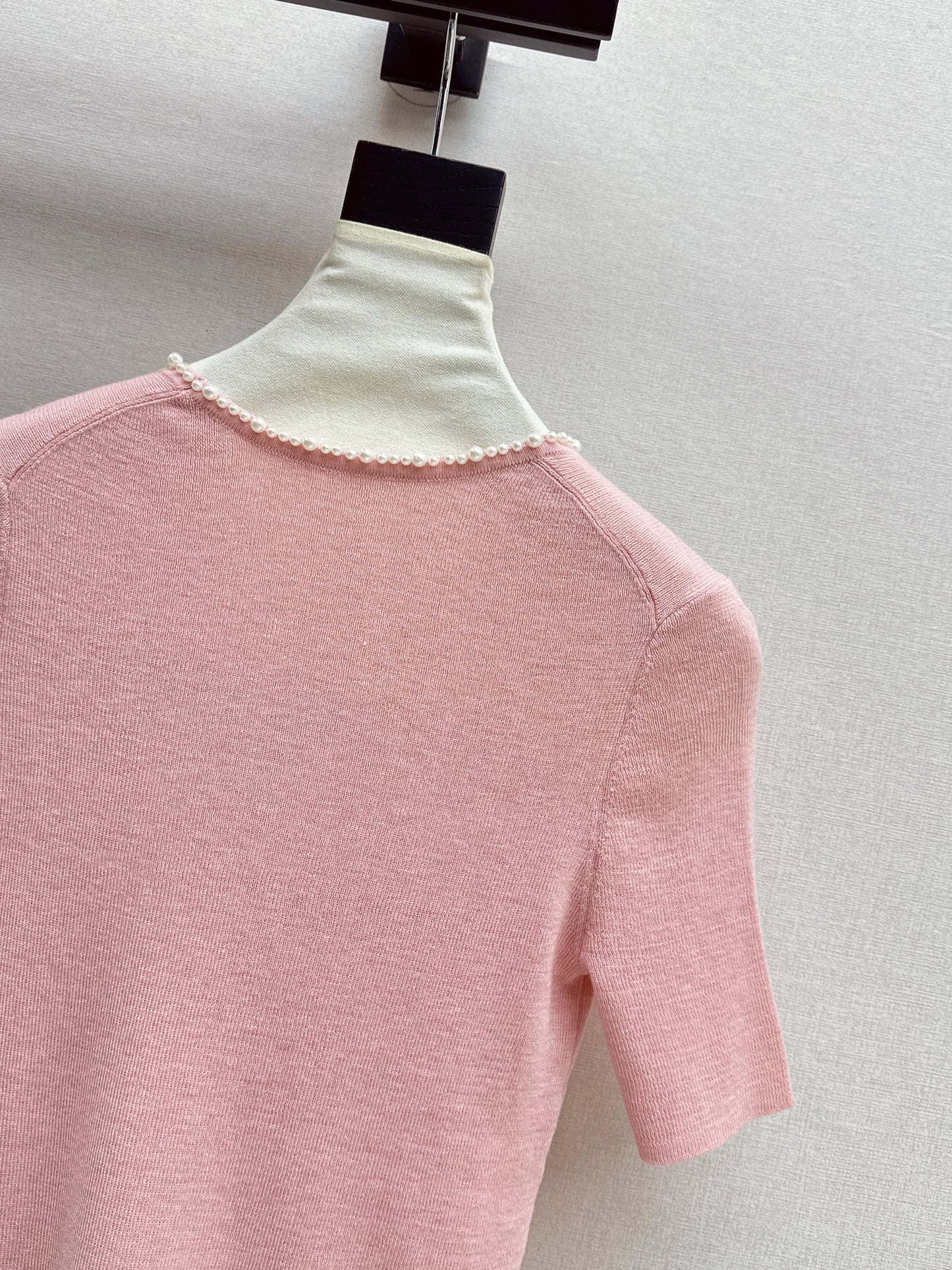 Pearl embellishments on a short-sleeved top