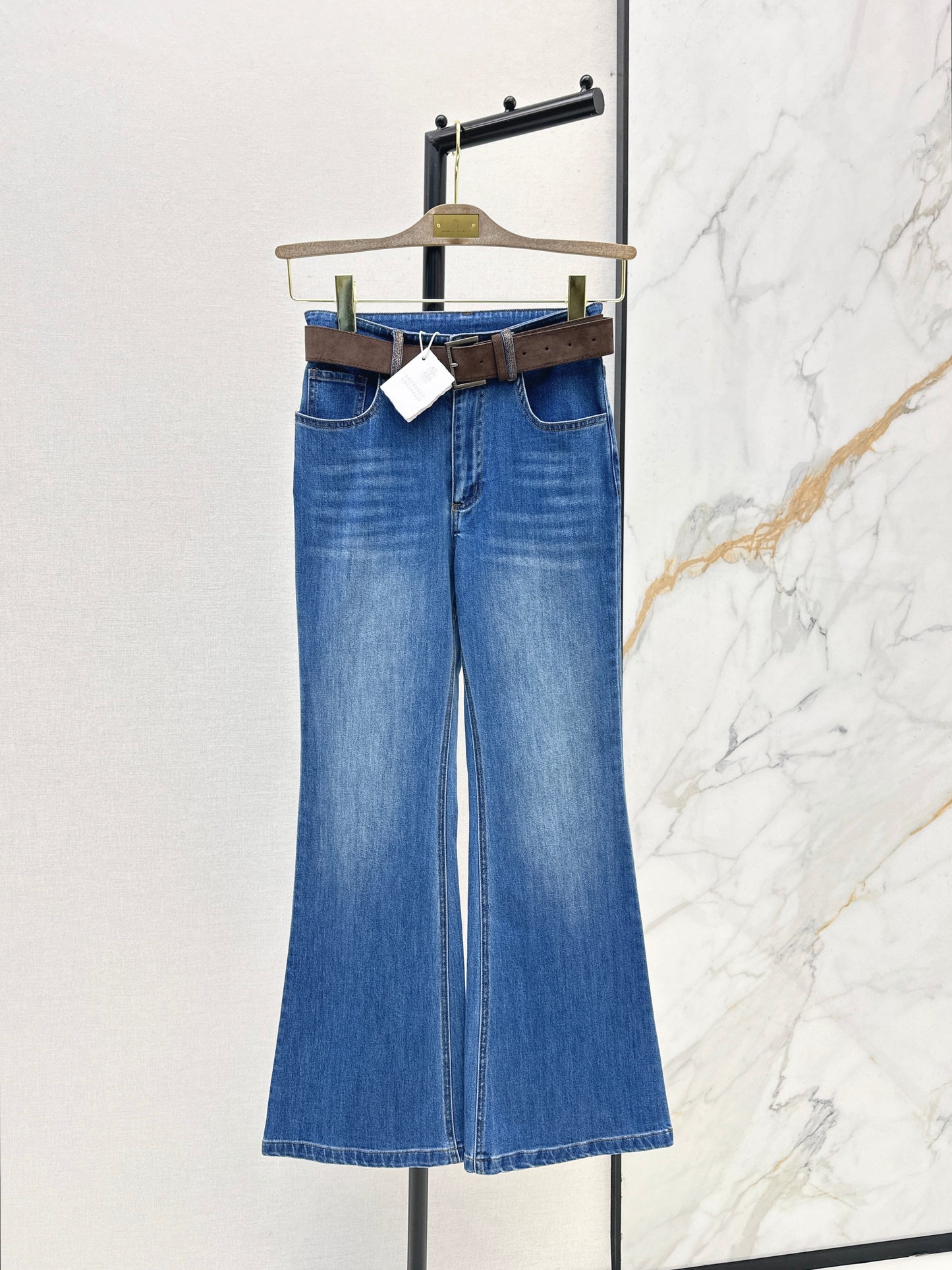 Belt-trimmed flared jeans