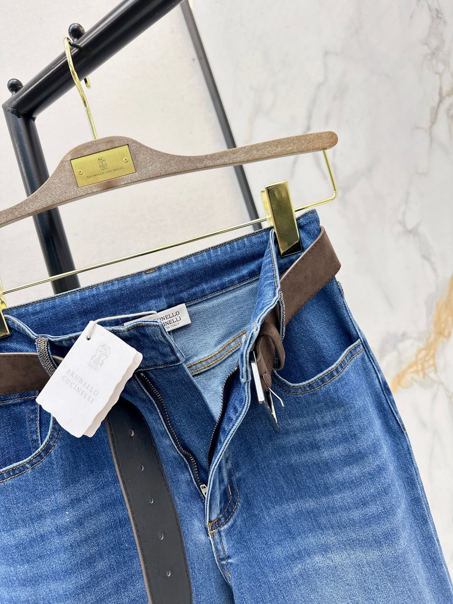 Belt-trimmed flared jeans