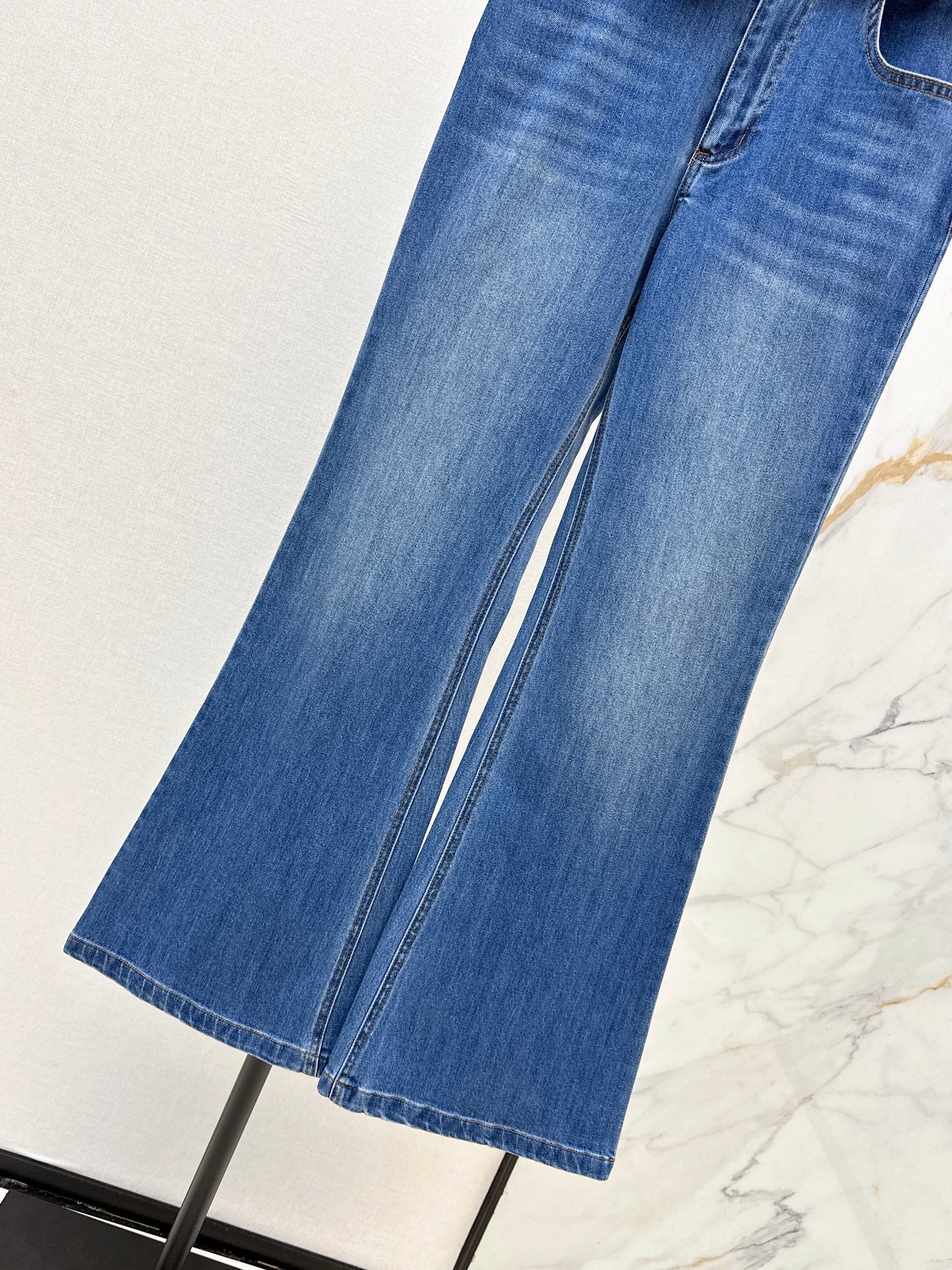 Belt-trimmed flared jeans