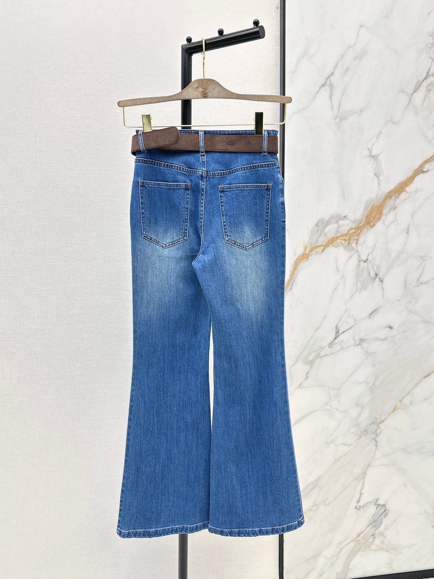 Belt-trimmed flared jeans