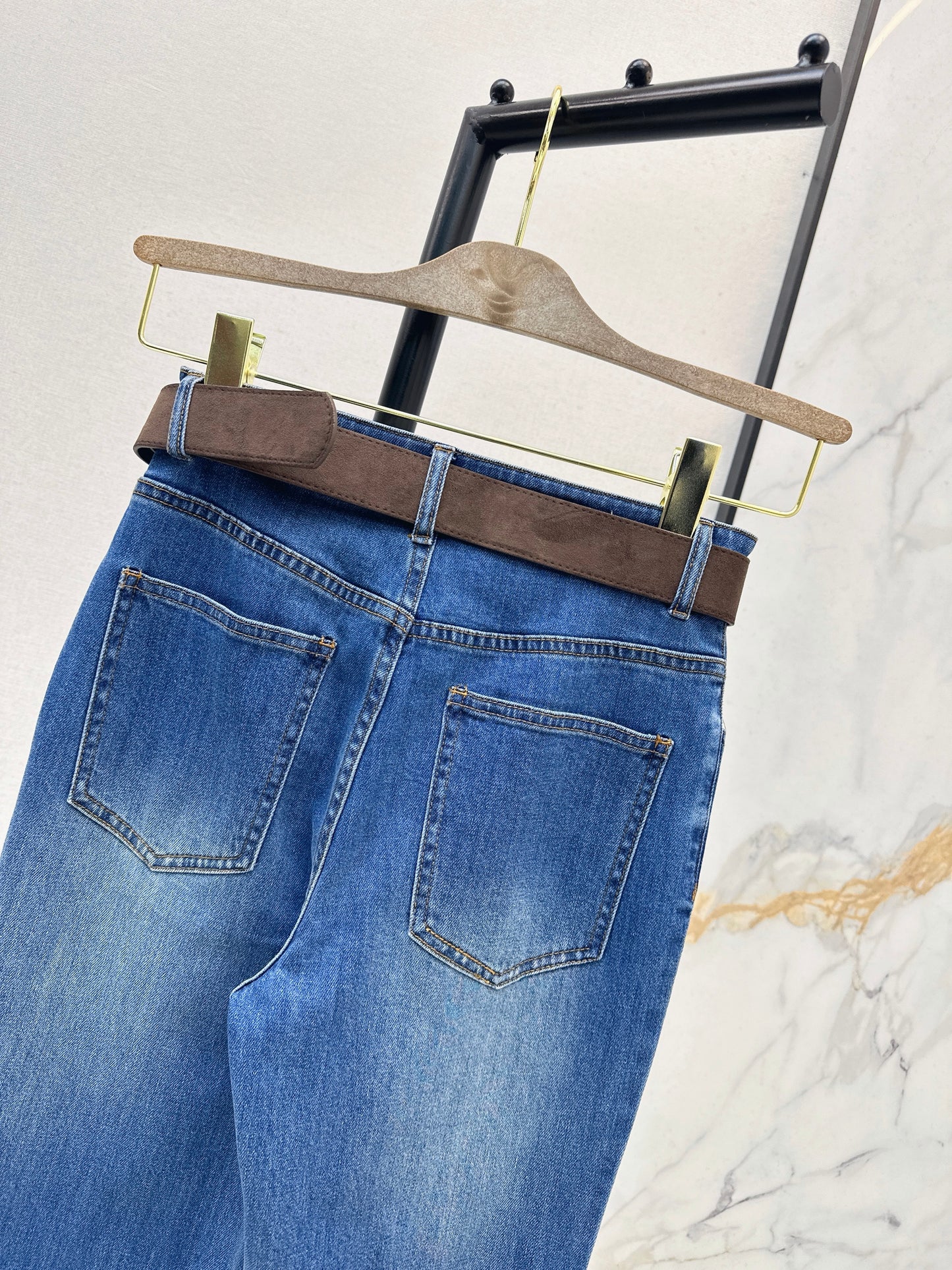 Belt-trimmed flared jeans