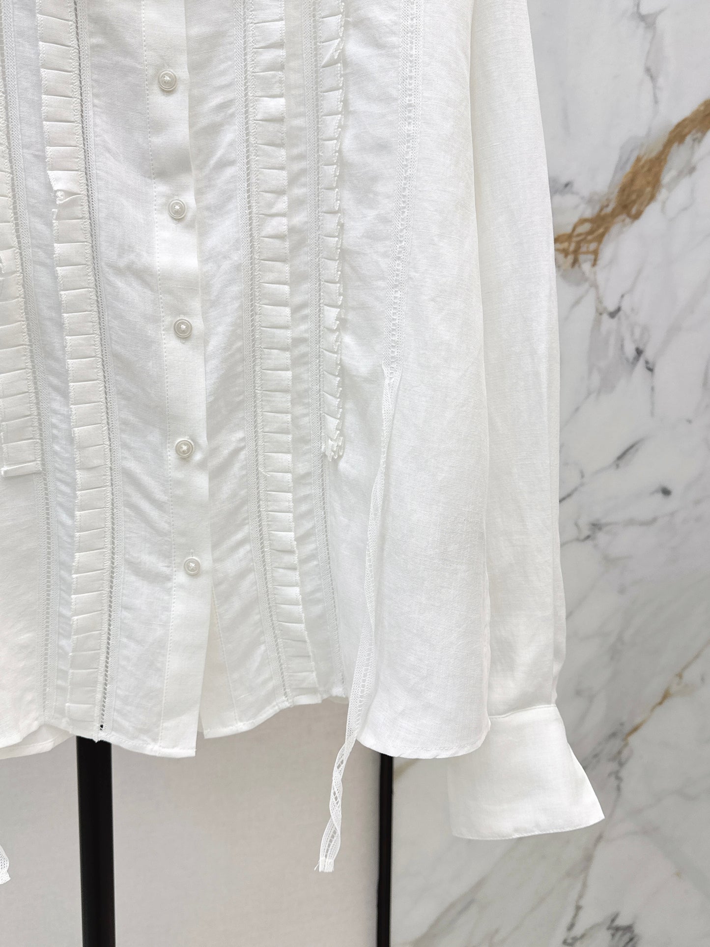 White shirt with ruffled trim