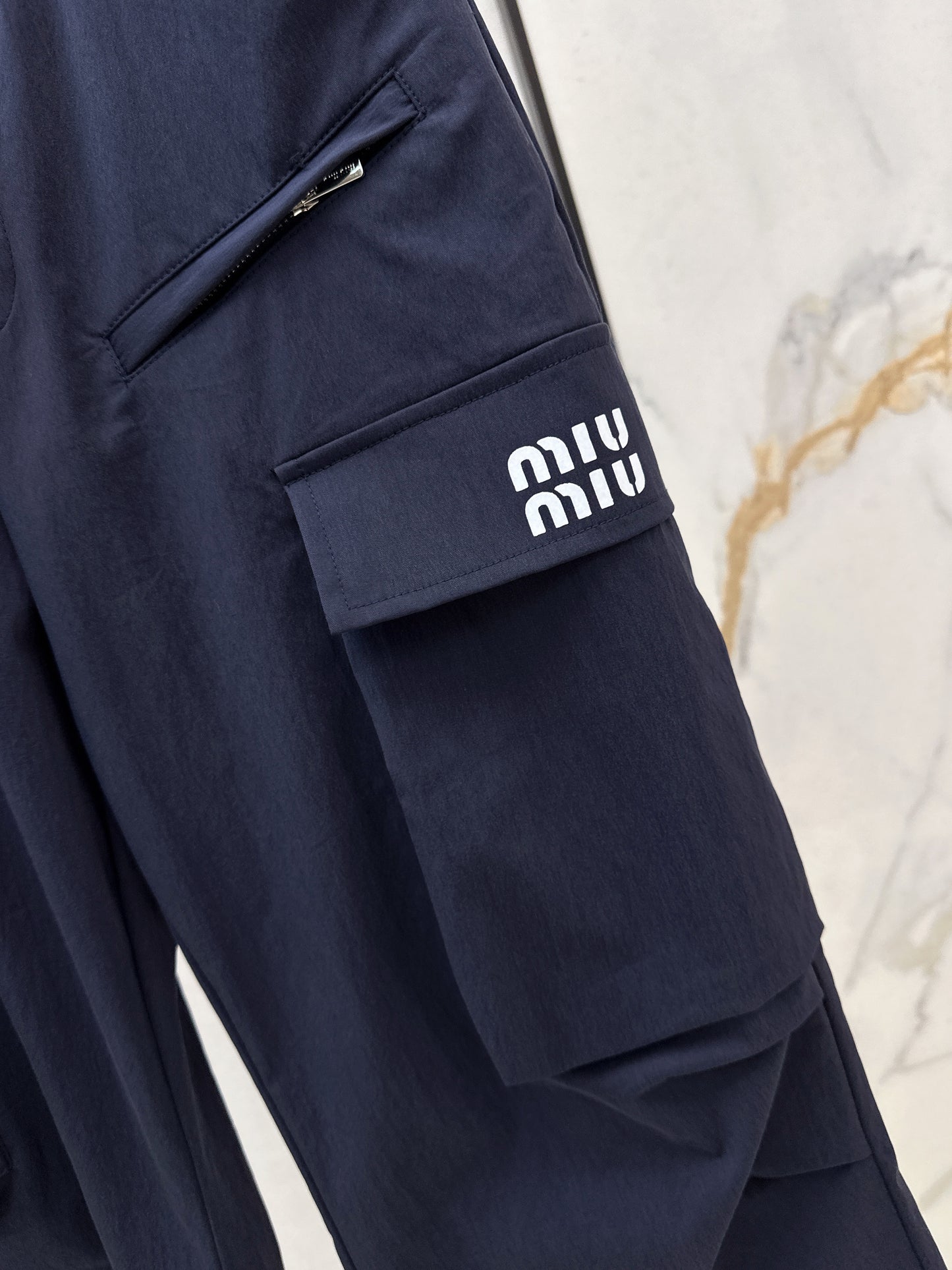 26ss Cargo-style wide-leg trousers