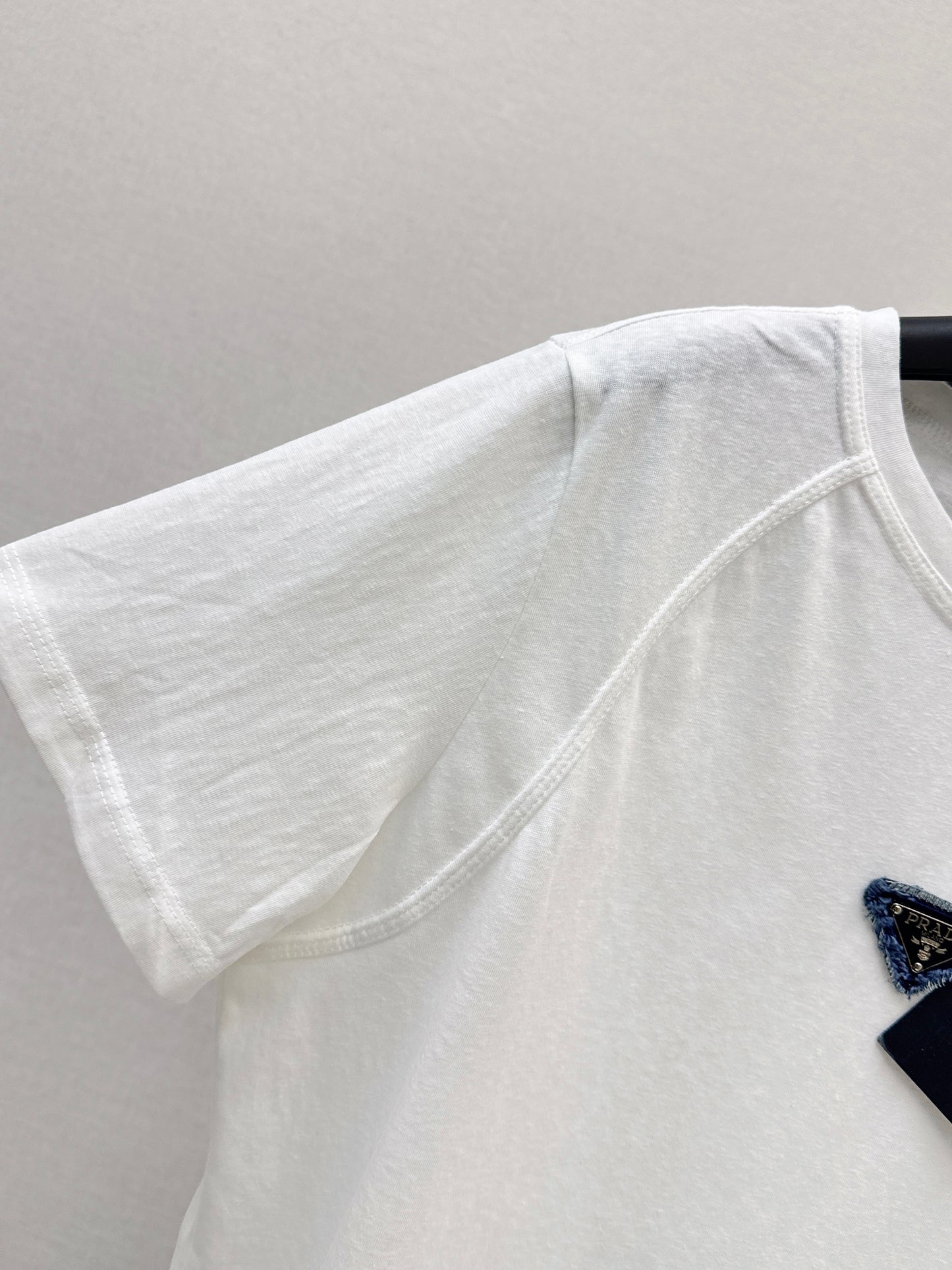 26ss Triangle logo embellished T-shirt