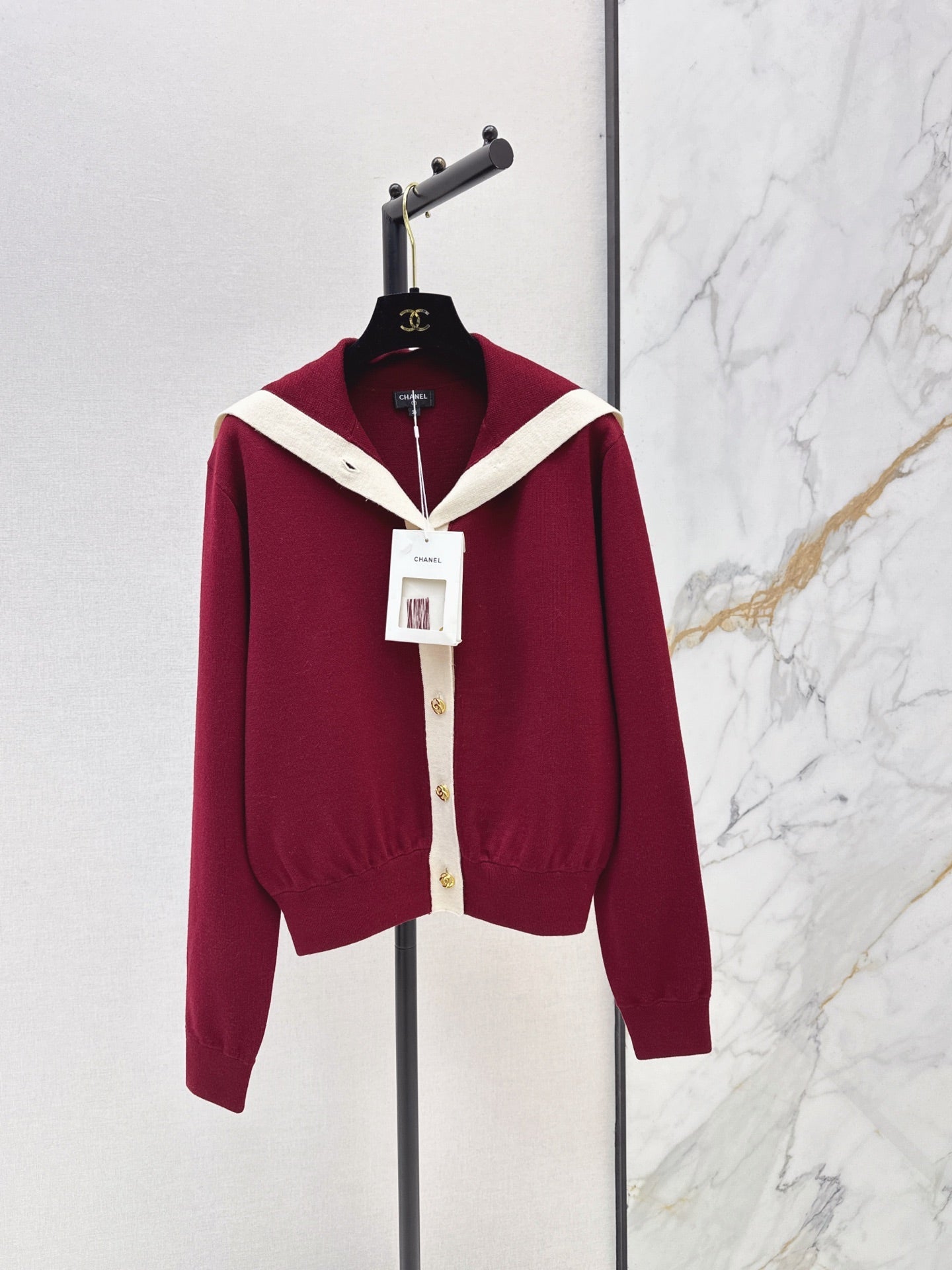 Color-block knit cardigan featuring a nautical-style collar