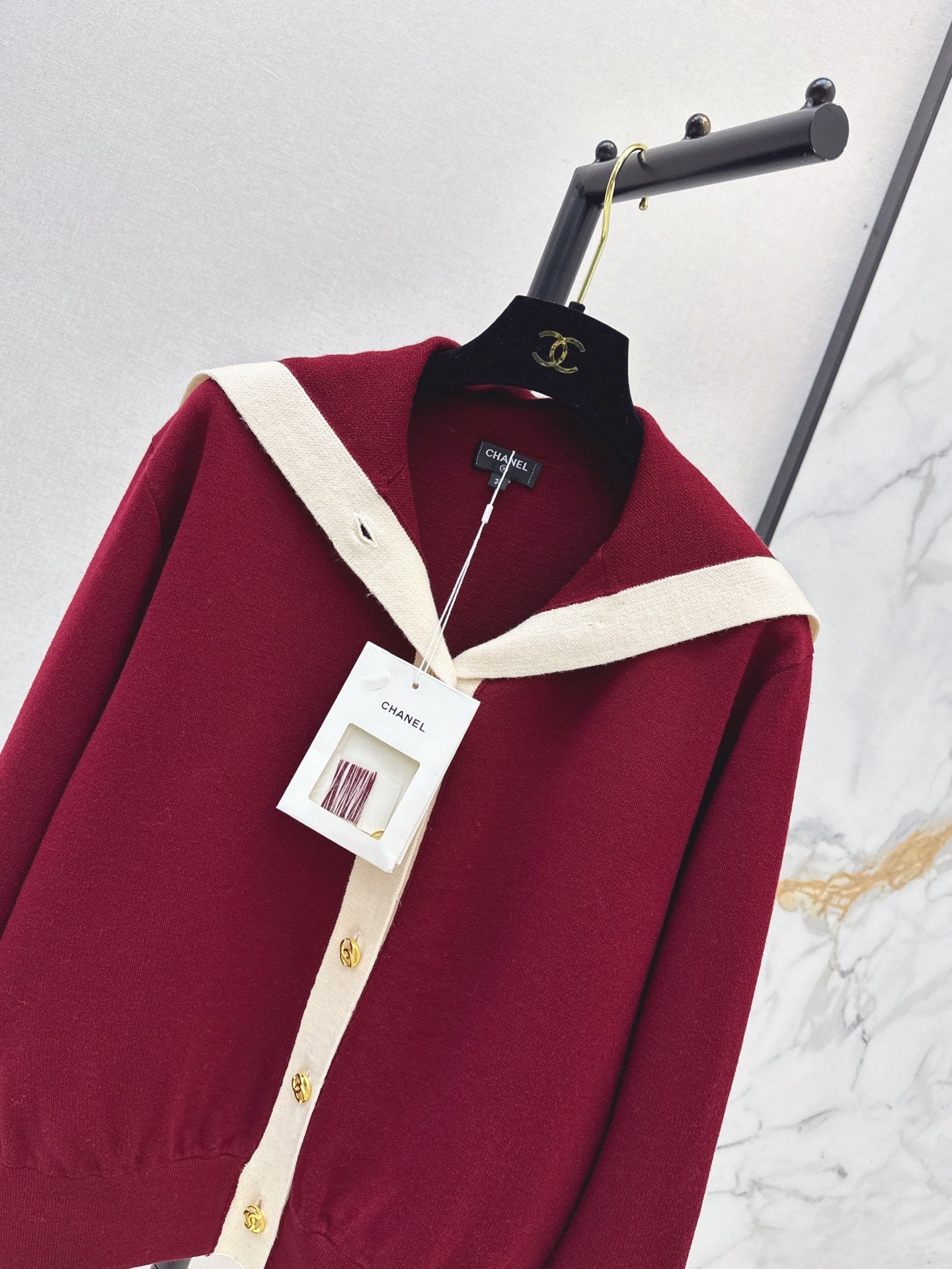 Color-block knit cardigan featuring a nautical-style collar