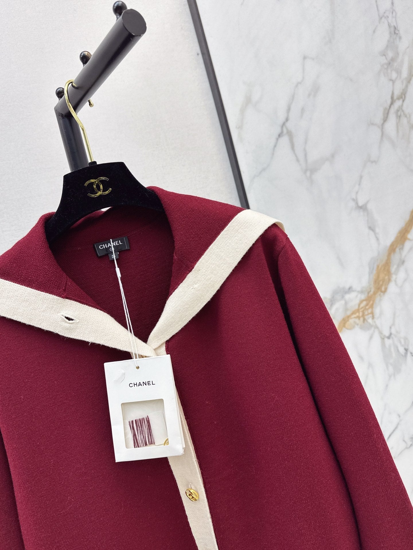 Color-block knit cardigan featuring a nautical-style collar