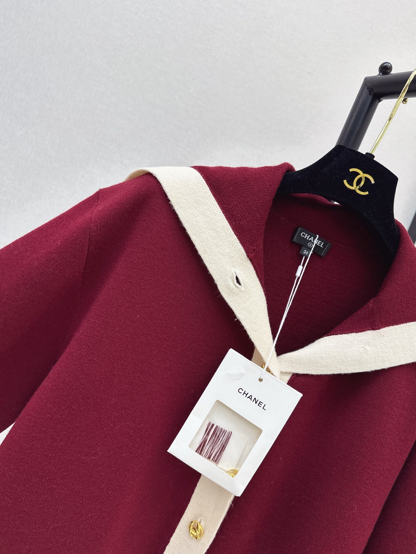Color-block knit cardigan featuring a nautical-style collar