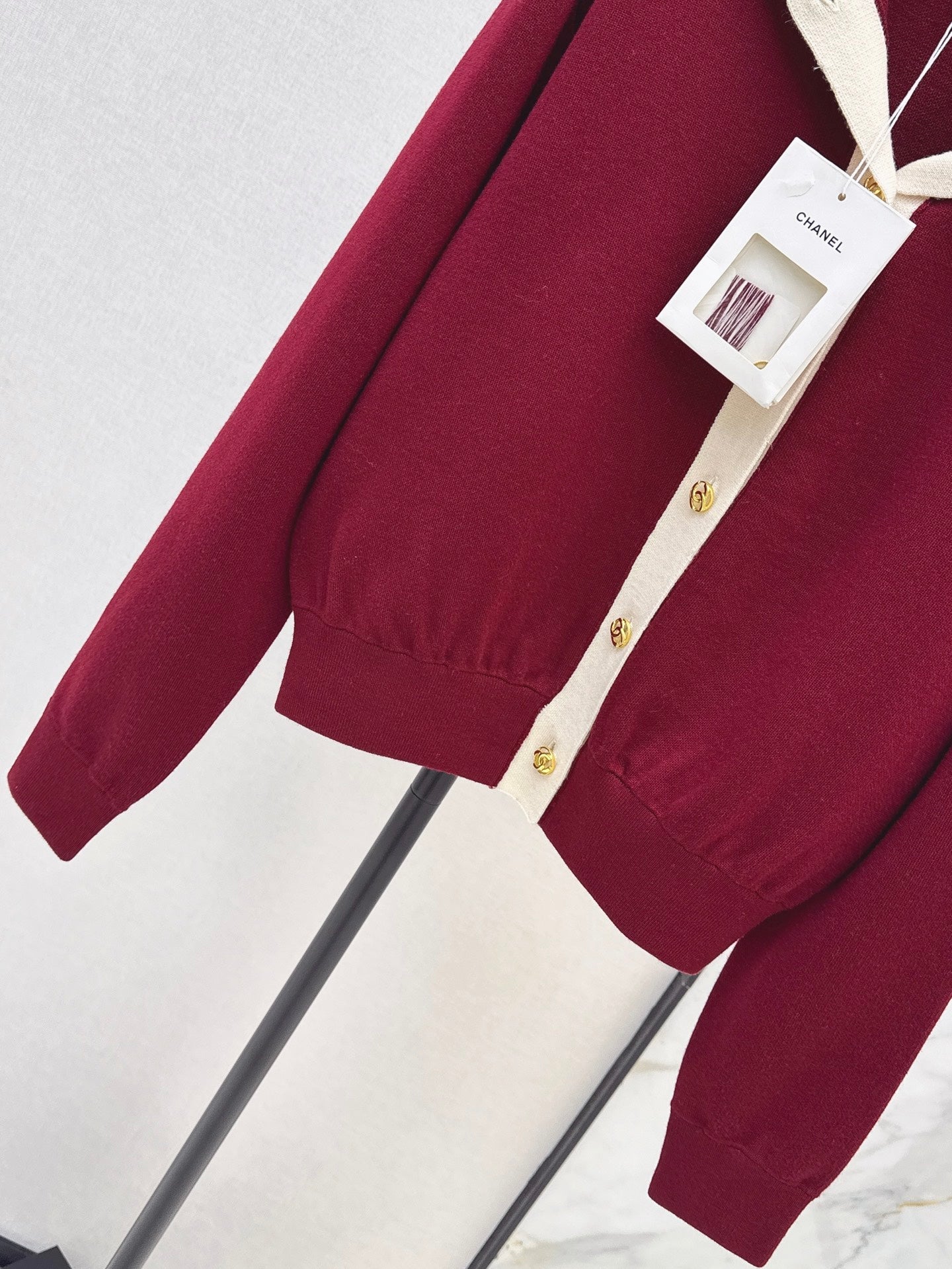 Color-block knit cardigan featuring a nautical-style collar