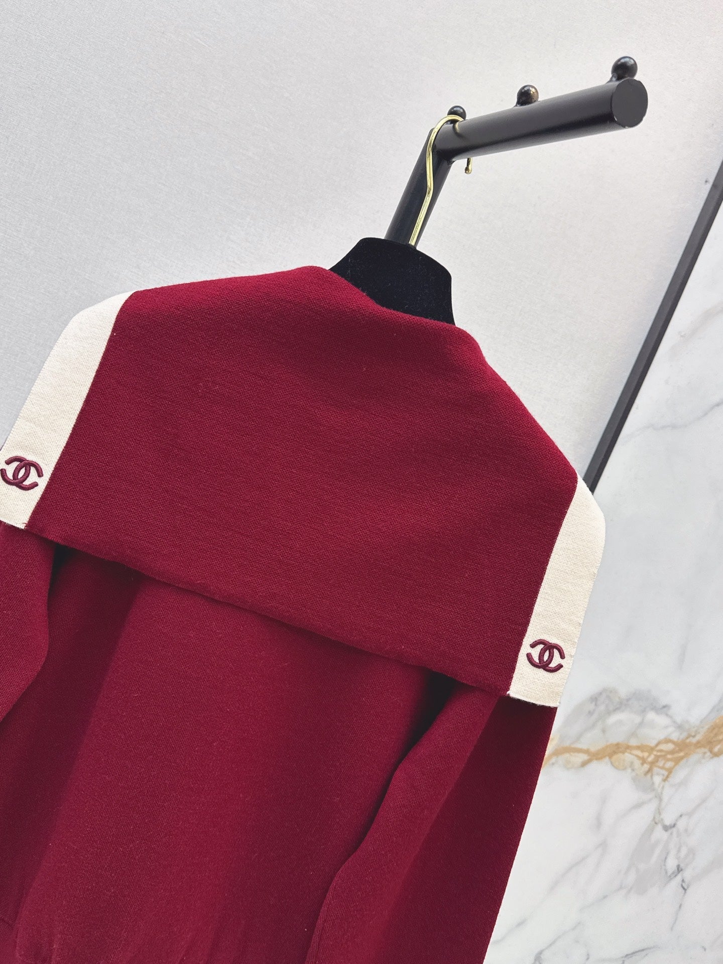 Color-block knit cardigan featuring a nautical-style collar