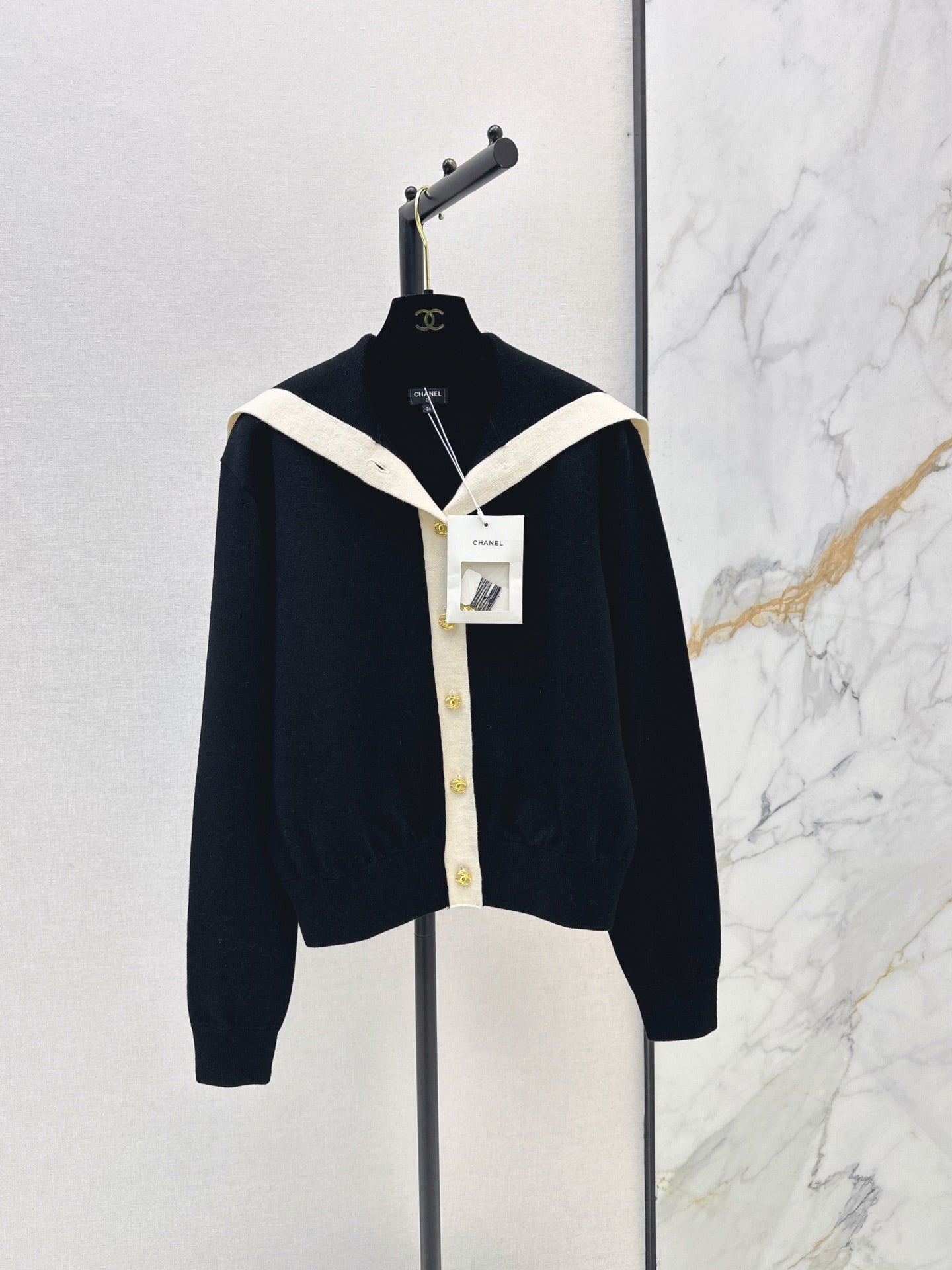 Color-block knit cardigan featuring a nautical-style collar