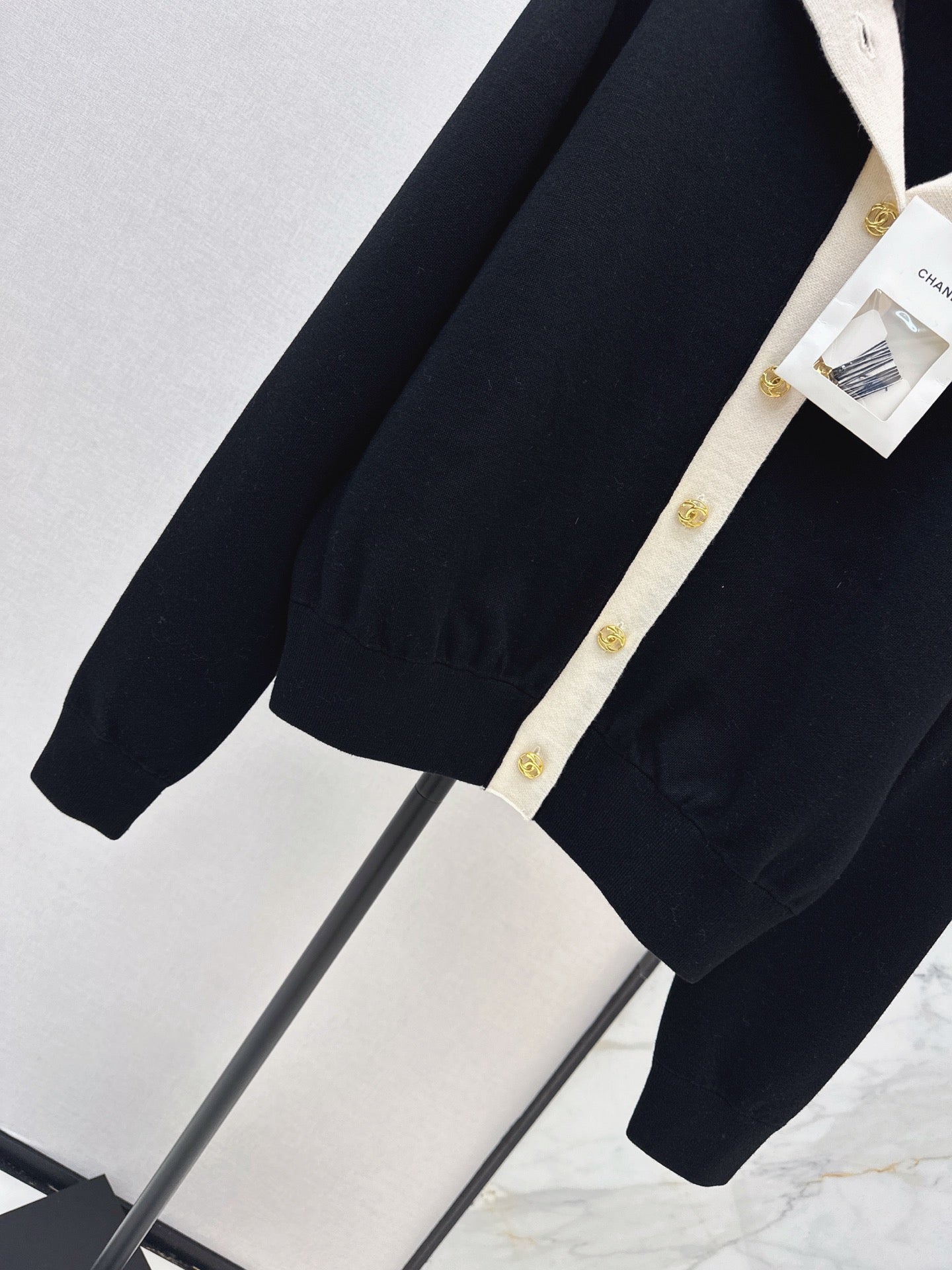 Color-block knit cardigan featuring a nautical-style collar