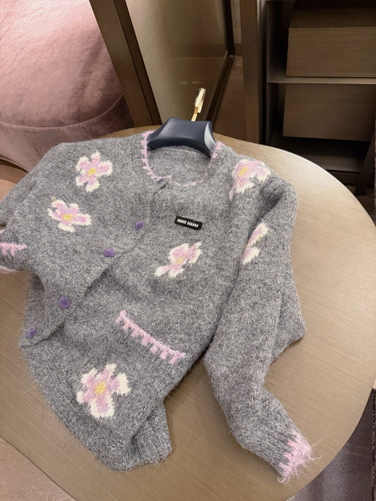 26Mohair-style knit cardigan—a piece that exudes an air of luxury.