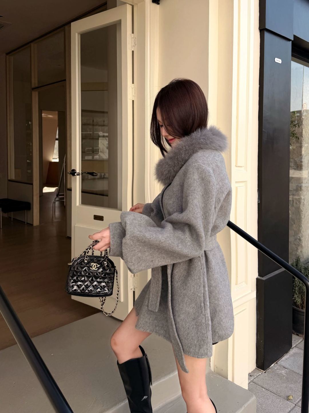 Mid-length coat with fox fur trim