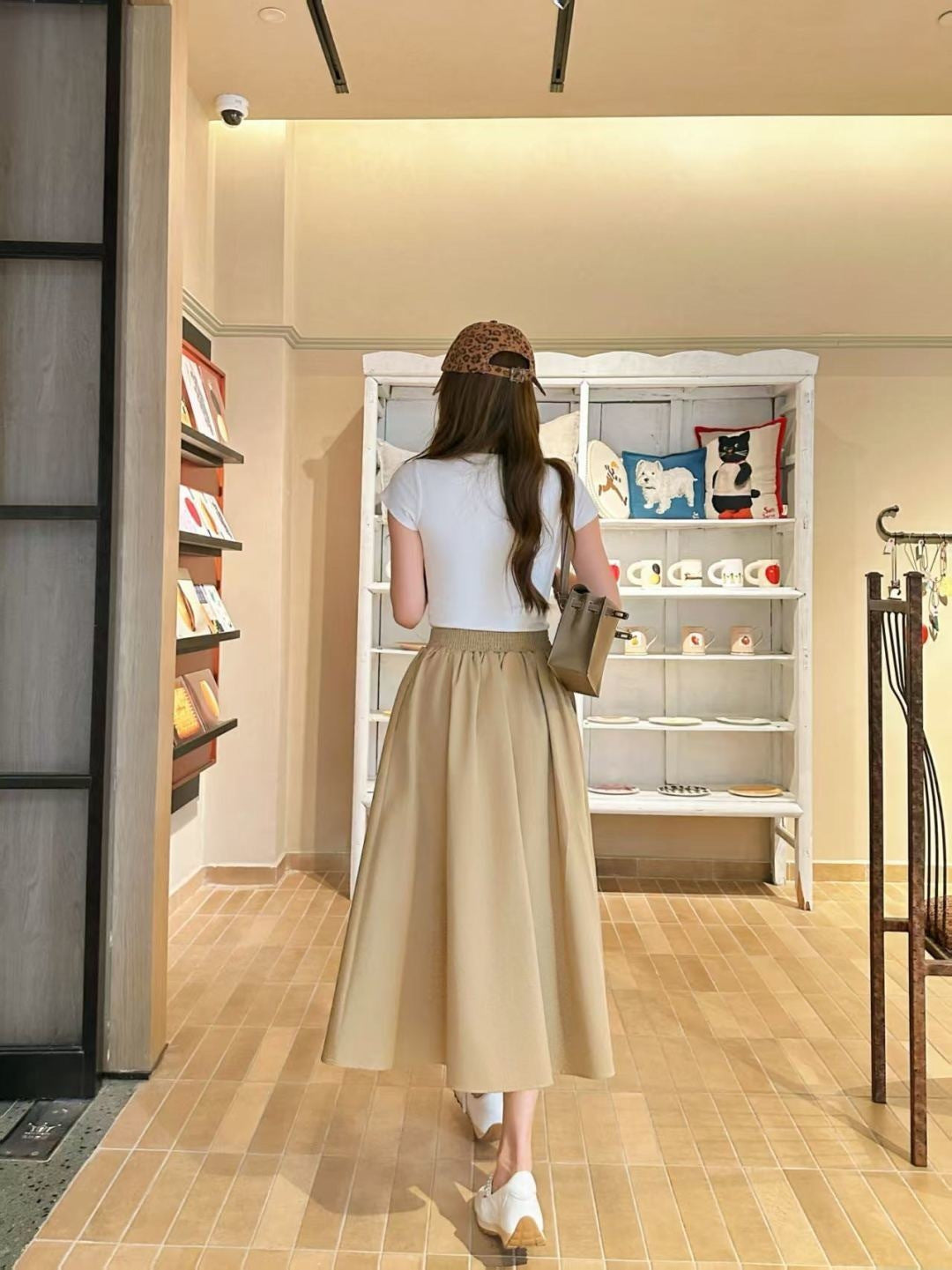 Leather-buckled A-line skirt