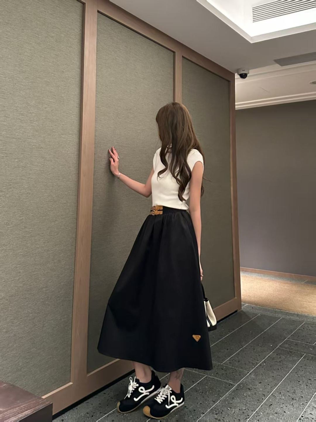 Leather-buckled A-line skirt