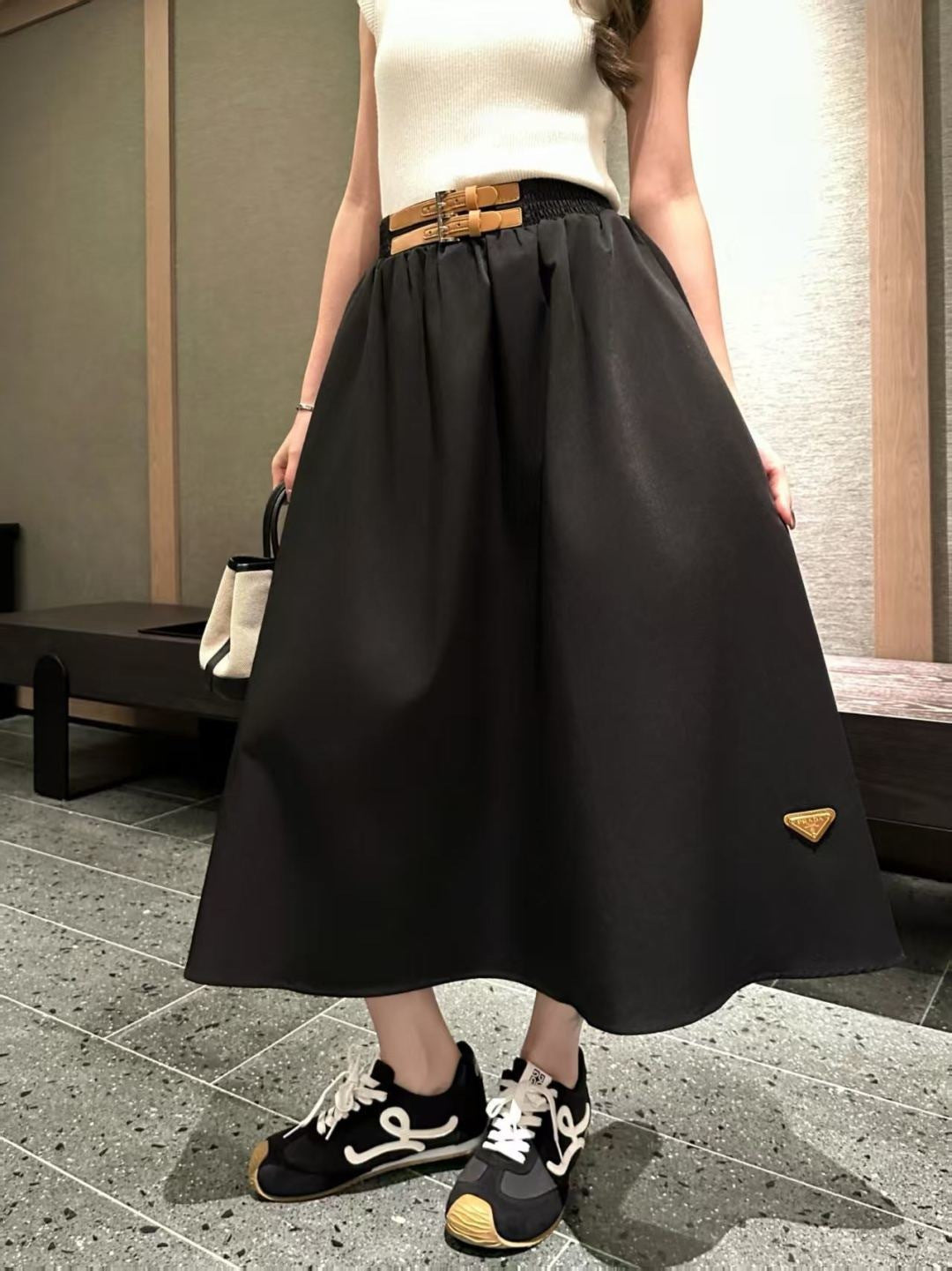 Leather-buckled A-line skirt