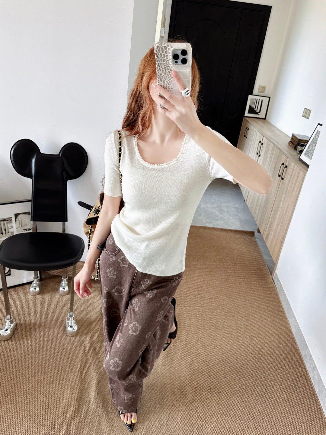 Pearl embellishments on a short-sleeved top