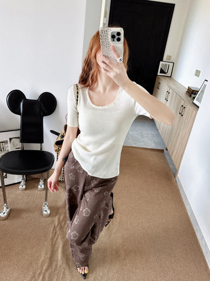Pearl embellishments on a short-sleeved top