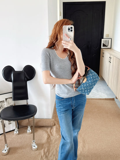 Pearl embellishments on a short-sleeved top