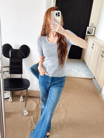 Pearl embellishments on a short-sleeved top