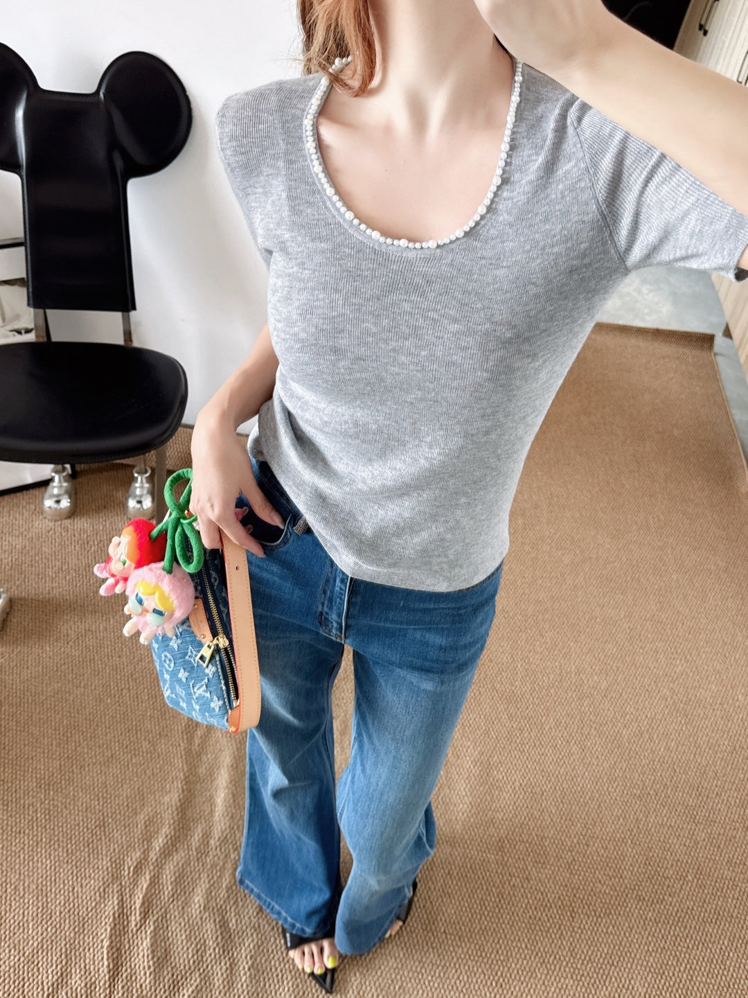 Pearl embellishments on a short-sleeved top