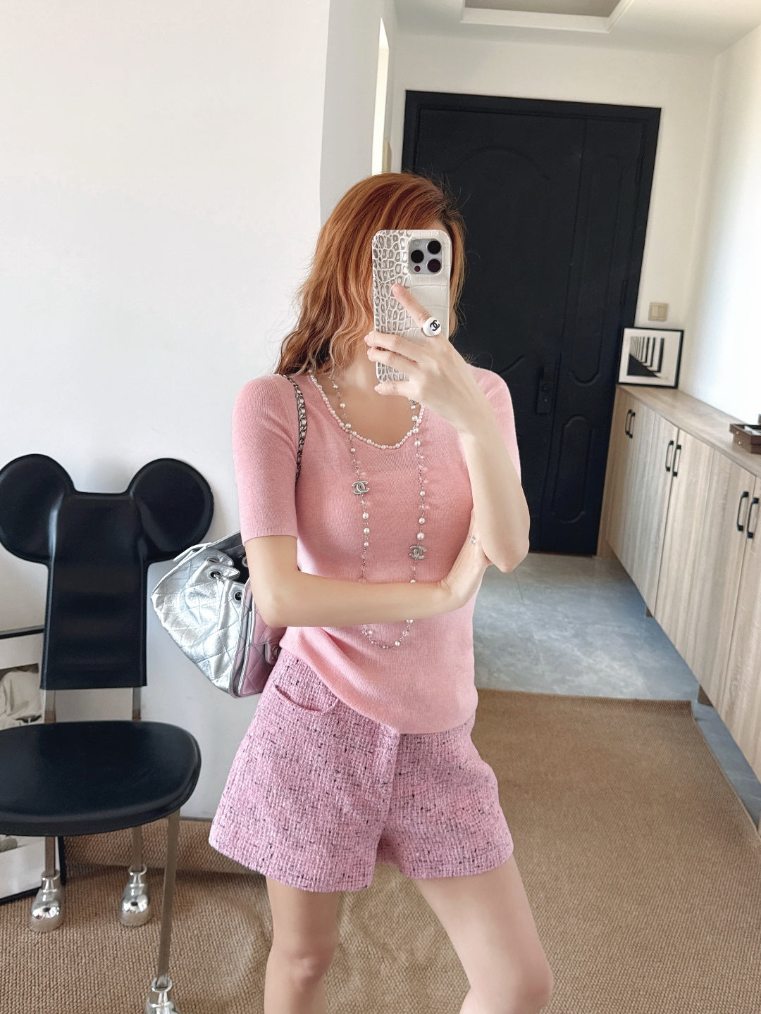 Pearl embellishments on a short-sleeved top