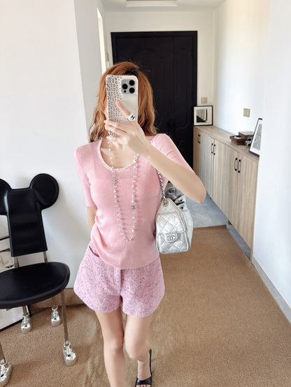 Pearl embellishments on a short-sleeved top