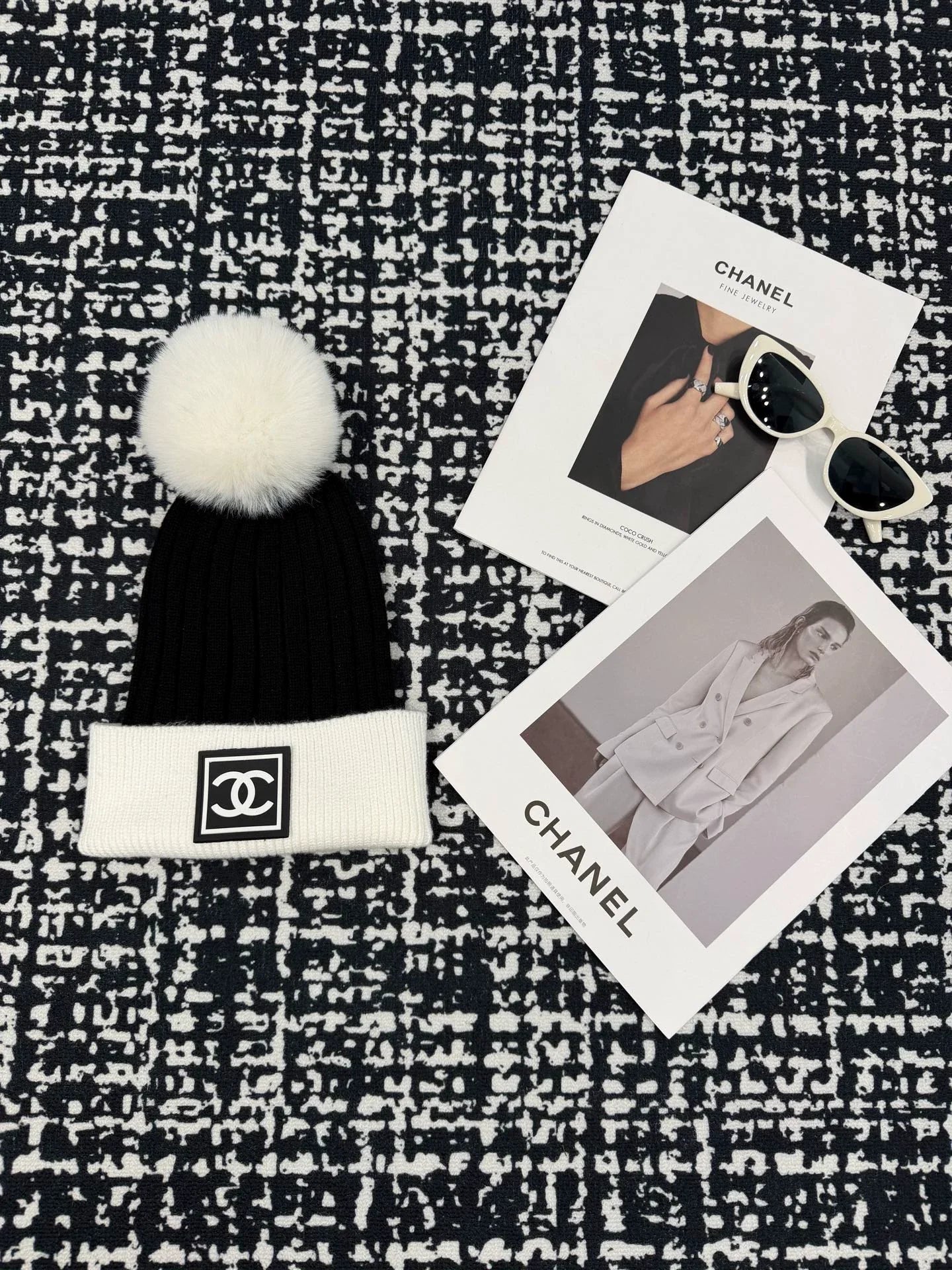 Black and white contrasting ball knitted hat