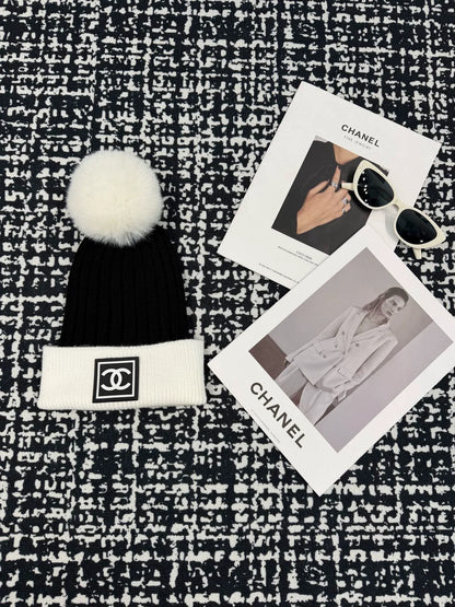 Black and white contrasting ball knitted hat