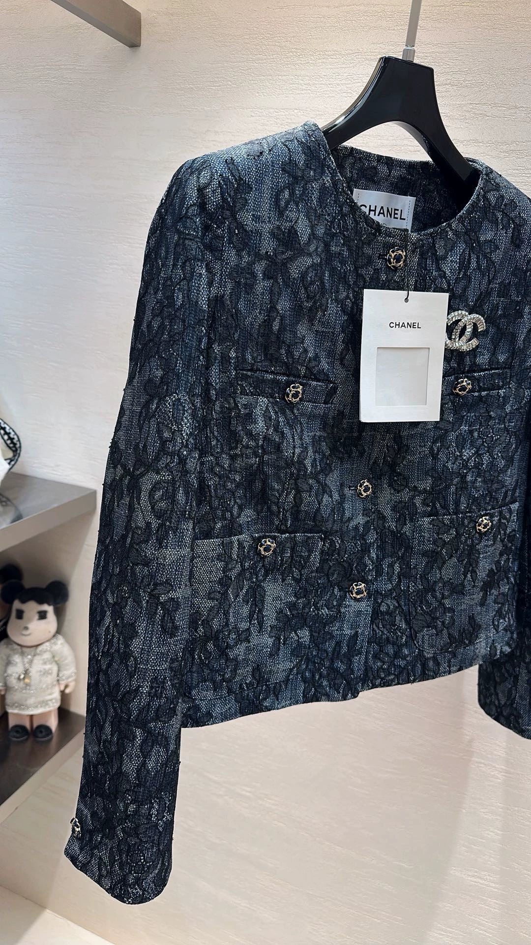 Brooch-adorned jacket