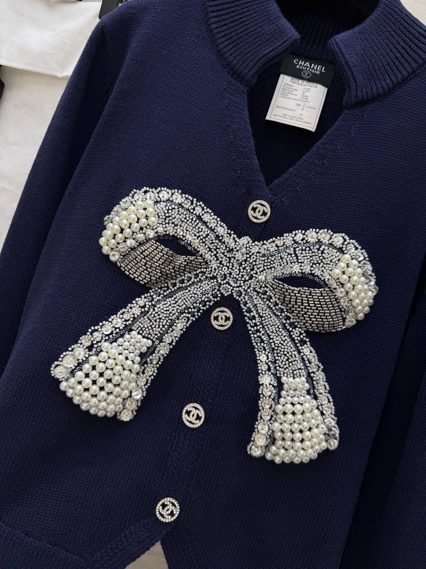Pearl-studded bow pullover