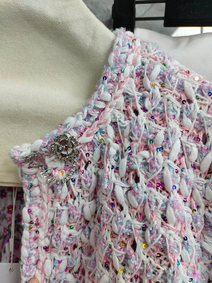 26Pink-and-white tweed, openwork, cropped, Chanel-style round-neck jacket