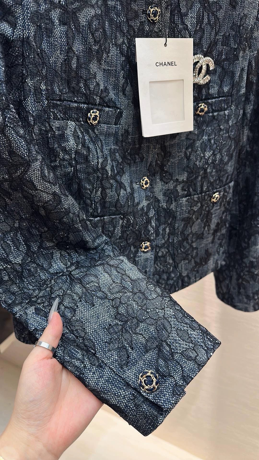 Brooch-adorned jacket
