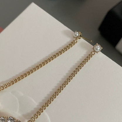 Long chain hanging double C-ear studs