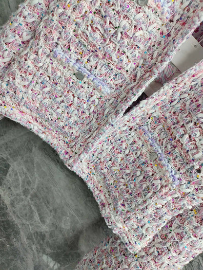 26Pink-and-white tweed, openwork, cropped, Chanel-style round-neck jacket