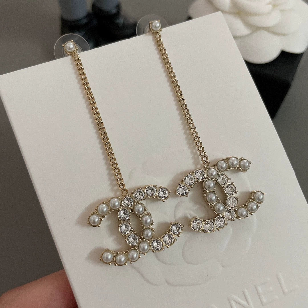 Long chain hanging double C-ear studs