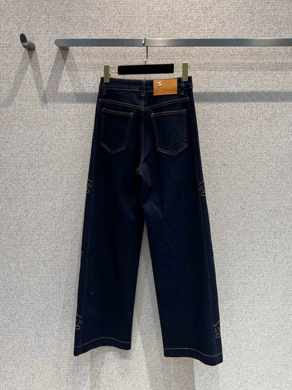 Side-embroidered washed denim jeans