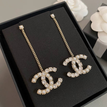 Long chain hanging double C-ear studs