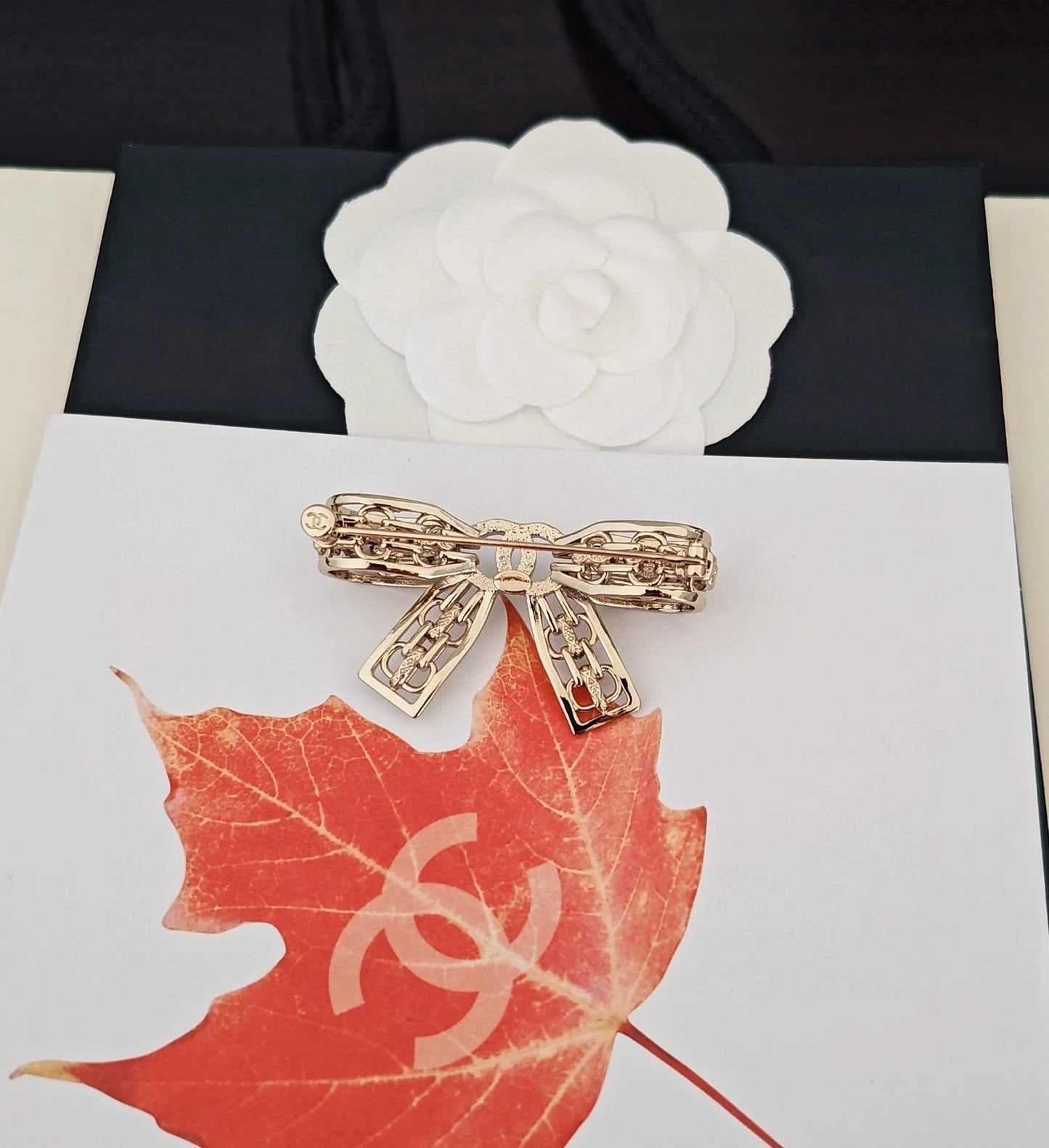 Light gold hollow bow brooch