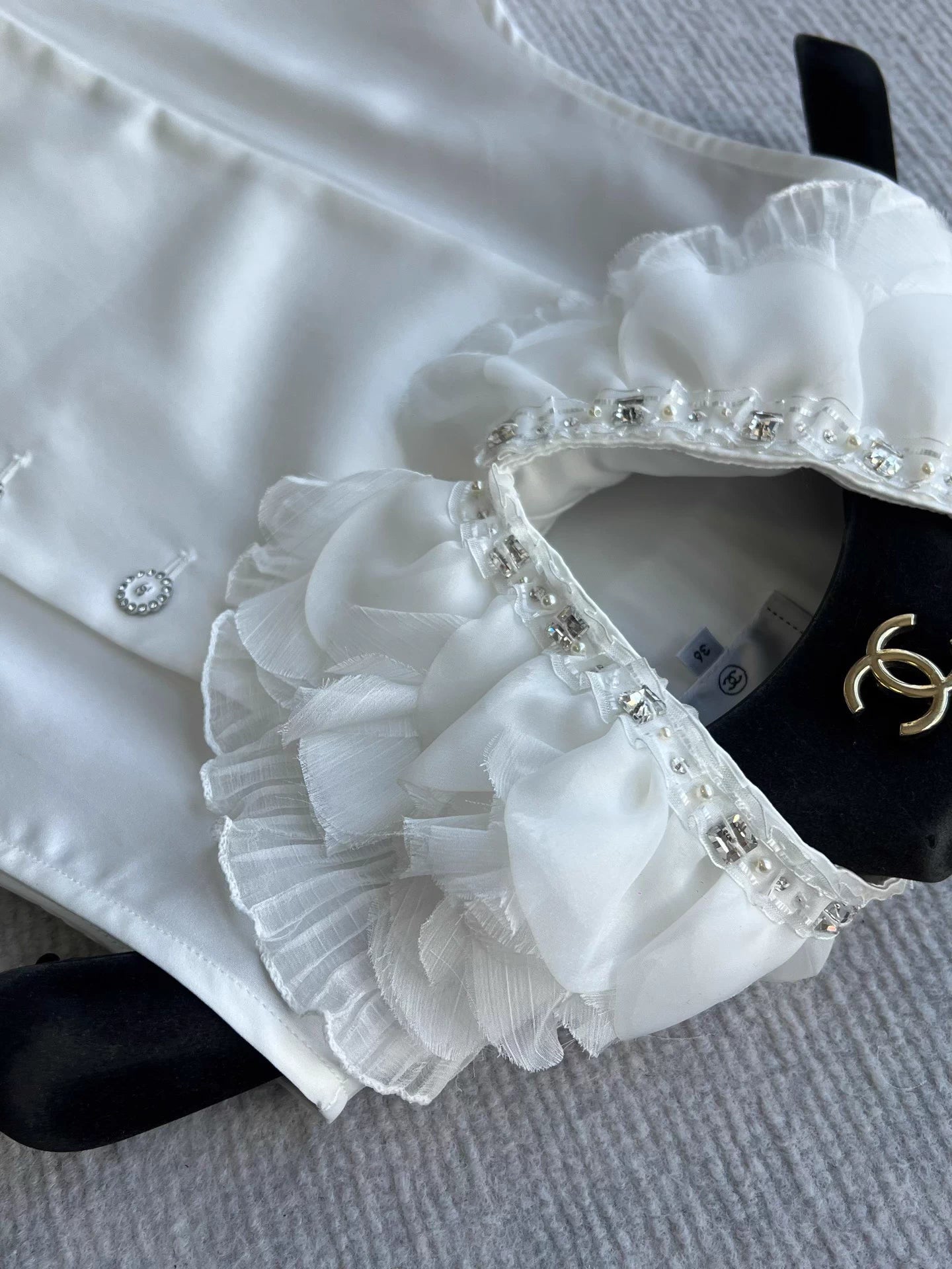 Sleeveless side-button petal blouse
