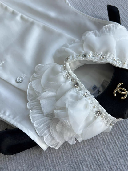 Sleeveless side-button petal blouse